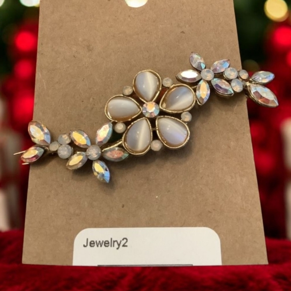Vintage hair clip with pink stones floral pattern gold clip very pretty.